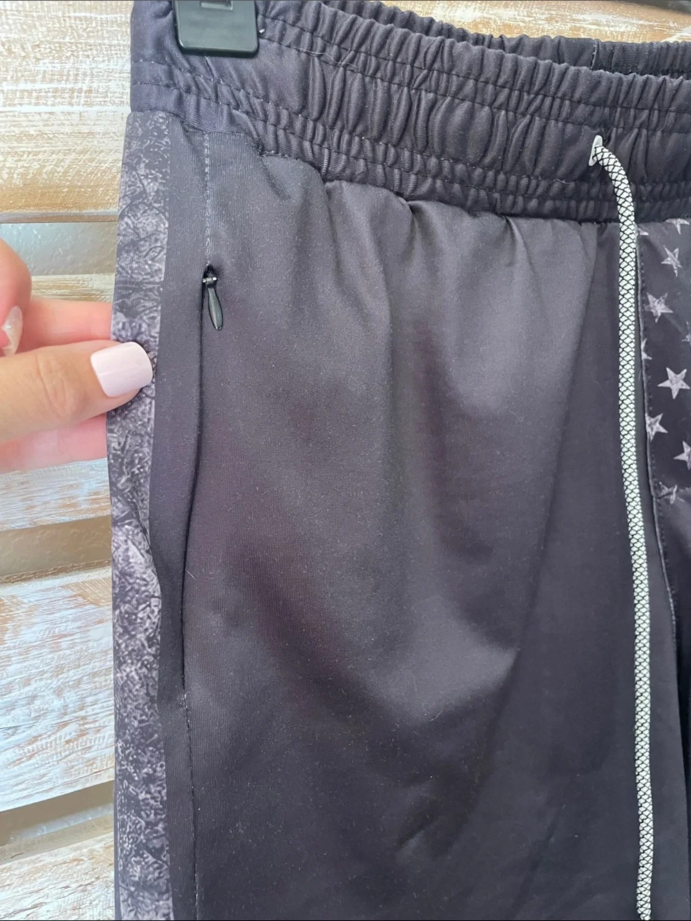 black tactical-style swim trunks by FT Fenteng | faded American flag has pockets